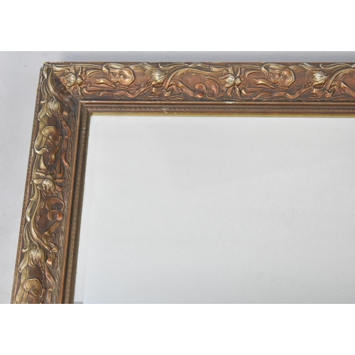 580 - A Modern Gilt Framed Wall Mirror, 107x79cms