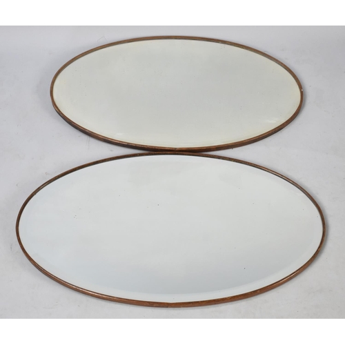 584 - Two Mid 20th Century Oval Bevel Edged Wall Mirrors, 62cms Wide