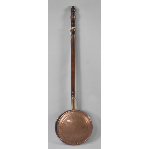 589 - A Copper Bed Warming Pan with Turned Wooden Handle