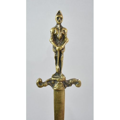 65 - A Carved African Souvenir Letter Opener with Mask Handle and Blade in the Form of Scimitar, together... 