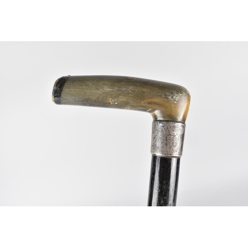 7 - A Silver Mounted Horn Handled Ebonized Walking Cane