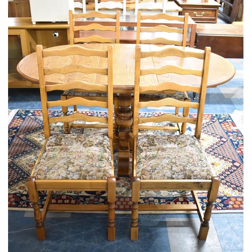 494 - A Mid 20th Century Oak Extending Drop Leaf Oval Topped Dining Table and Set of Four Ladder Back Chai... 