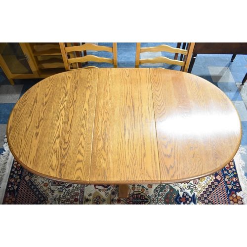 494 - A Mid 20th Century Oak Extending Drop Leaf Oval Topped Dining Table and Set of Four Ladder Back Chai... 