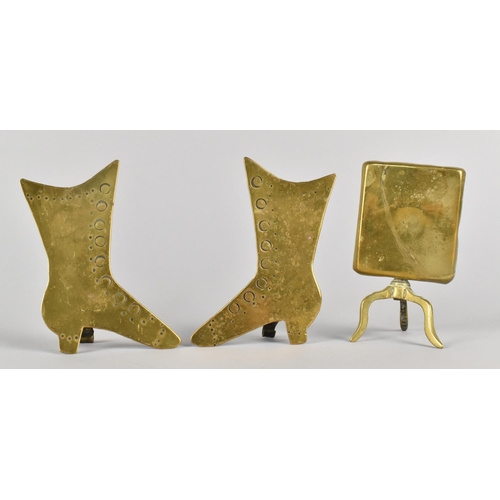 10 - A Pair of Novelty Brass Ornaments in the Form of Ladies Boots together with a Candle Reflector in th... 