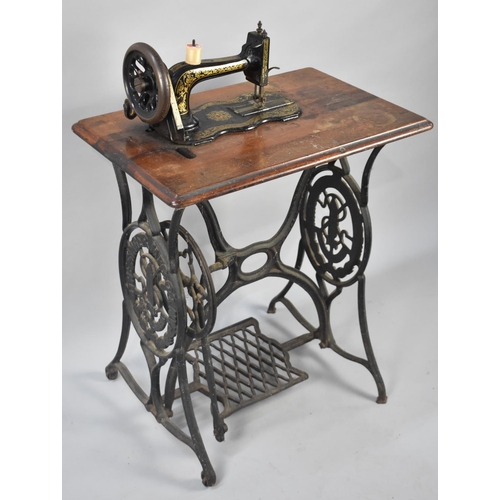 104 - A Vintage Singer Treadle Sewing Machine Base and a Vintage Sewing Machine, 65cms Wide