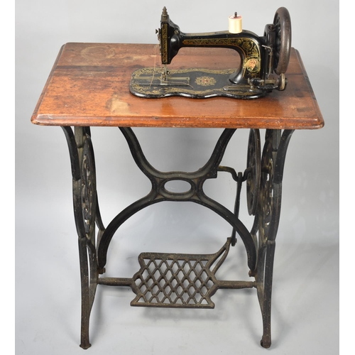 104 - A Vintage Singer Treadle Sewing Machine Base and a Vintage Sewing Machine, 65cms Wide