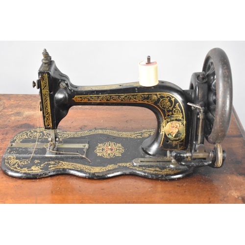 104 - A Vintage Singer Treadle Sewing Machine Base and a Vintage Sewing Machine, 65cms Wide