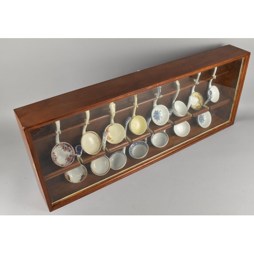 119 - A Modern Mahogany Case Containing Fifteen Late 19th Century and Later Ceramic Ladles, Case 82cms Lon... 