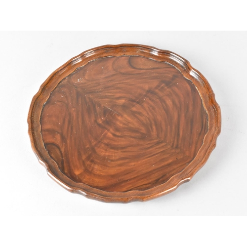 12 - A Small Mahogany Pie Crust Circular Tray, 23cms Diameter