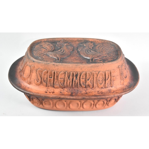 126 - A Continental Terracotta Lidded Cooking Pot, 37cms Wide