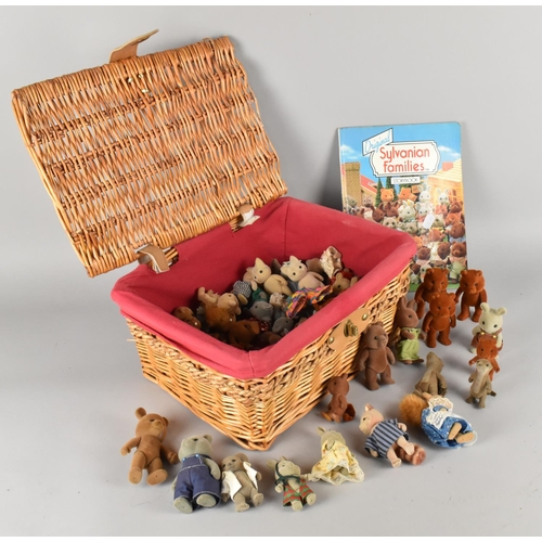 215 - A Wicker Basket Containing Sylvanian Families Figures, Story Book Etc