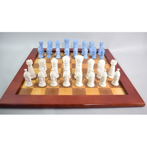 237 - An Interesting Cast Ceramic Chess Set, Kings 11cms High on Wooden Chessboard, 51cms Square