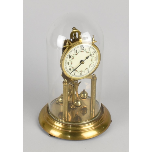 27 - A Mid 20th Century Brass Pillar Clock with Suspension Movement Under Glass Dome, 30cms High