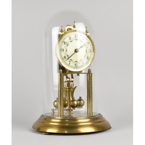 27 - A Mid 20th Century Brass Pillar Clock with Suspension Movement Under Glass Dome, 30cms High