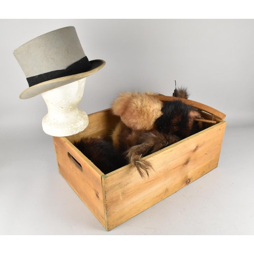 358 - A Wooden Crate Containing Various Fur Stoles and a Silhouette Dress Top Hat