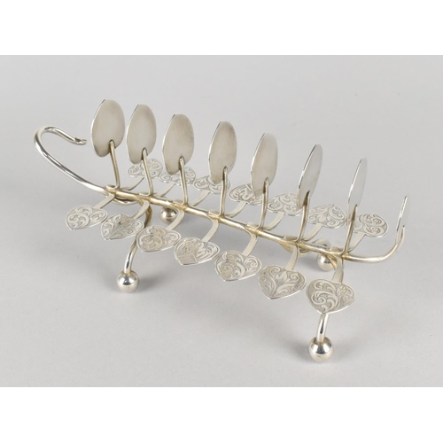 387 - A White Metal Eight Bar Toast Rack of Naturalistic Leaf and Tendril Form on Bun Feet with Engraved D... 