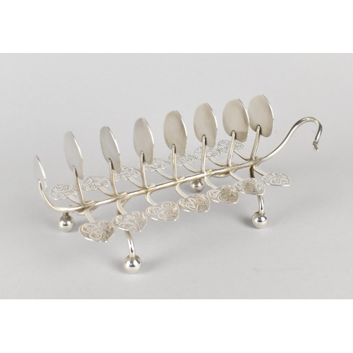 387 - A White Metal Eight Bar Toast Rack of Naturalistic Leaf and Tendril Form on Bun Feet with Engraved D... 