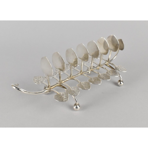 387 - A White Metal Eight Bar Toast Rack of Naturalistic Leaf and Tendril Form on Bun Feet with Engraved D... 