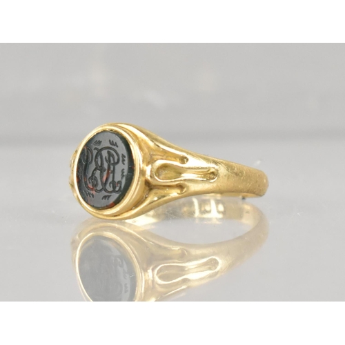 410 - A 19th Century Signet Ring, Oval Bloodstone Panel with Seal Marked ABJ, Collet Set to Fluted Shoulde... 