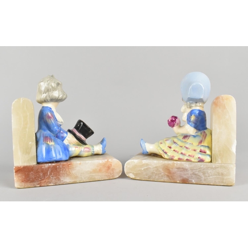 45 - A Pair of Mid 20th Century Onyx Bookends with Figural Mounts of Seated Boy and Girl, 15cms High