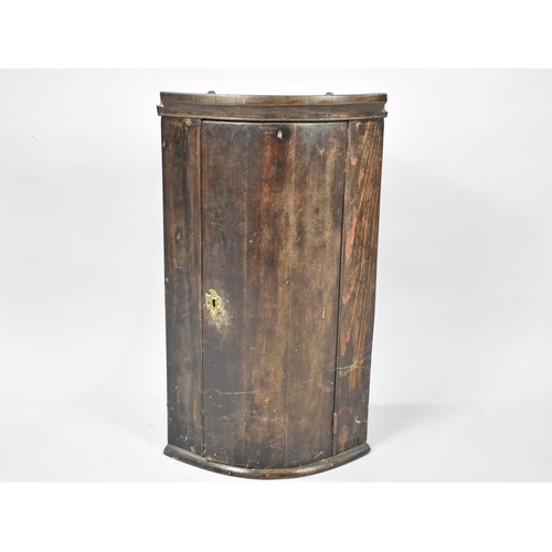 476 - A Small 19th Century Bow Fronted Corner Cabinet, 38cms Wide and 67cms High