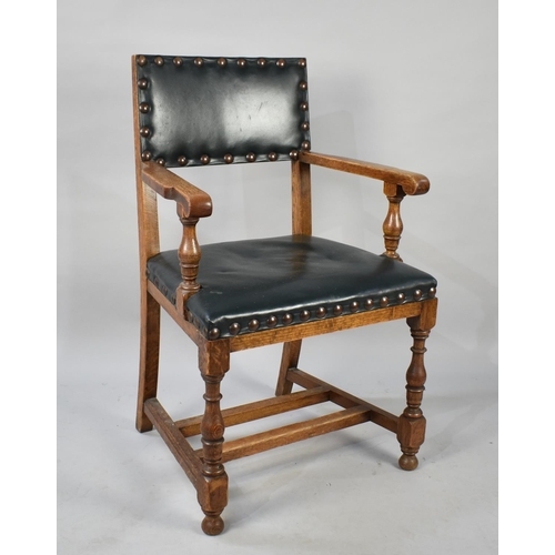 496 - An Edwardian Oak Framed Brass Studded and Leather Upholstered Armchair