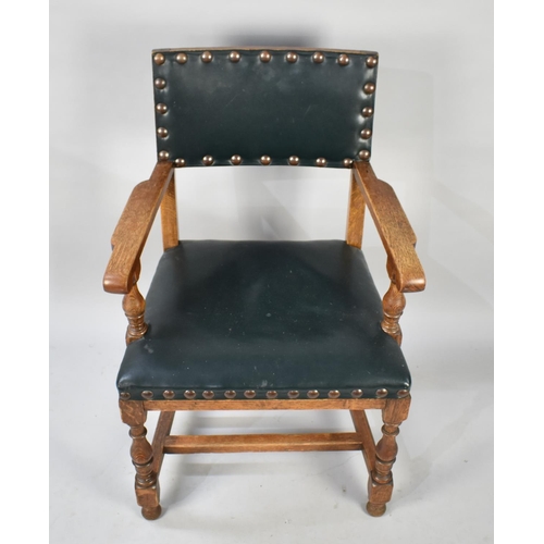 496 - An Edwardian Oak Framed Brass Studded and Leather Upholstered Armchair