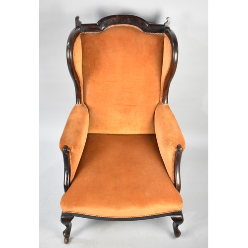 515 - An Edwardian Mahogany Farmed Wing Armchair