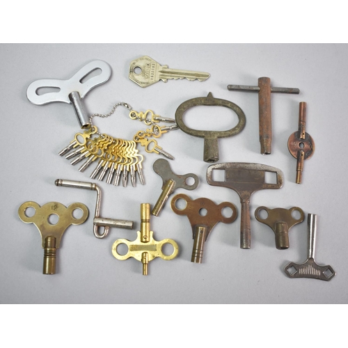 63 - A Collection of Twelve Clock Keys and Fourteen Watch Keys