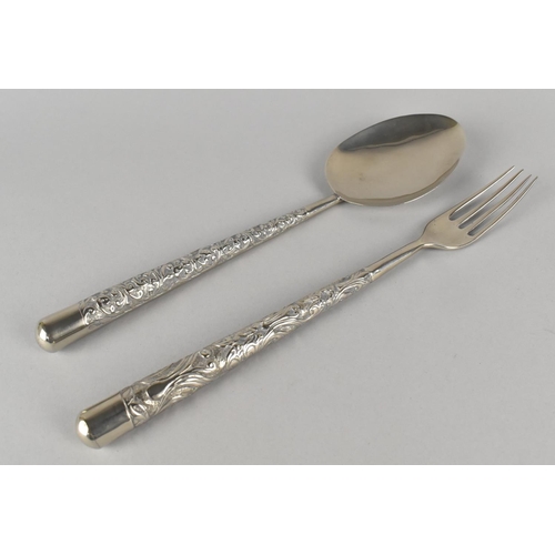 7 - A Pair of White Metal Salad Servers with Repousse Work Handles, 26cm Long