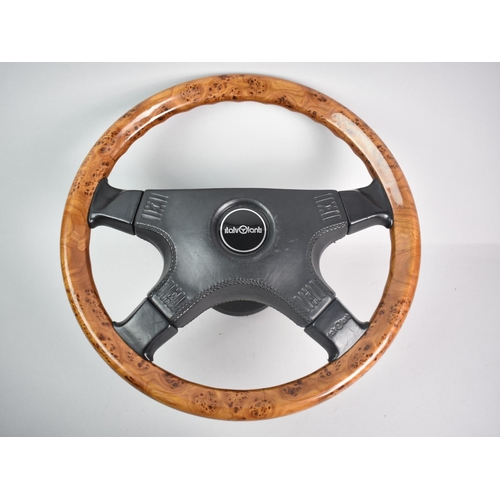 73 - A Vintage Ital Volanti Wooden Four Spoke Burr Wood Steering Wheel, 38cms Diameter