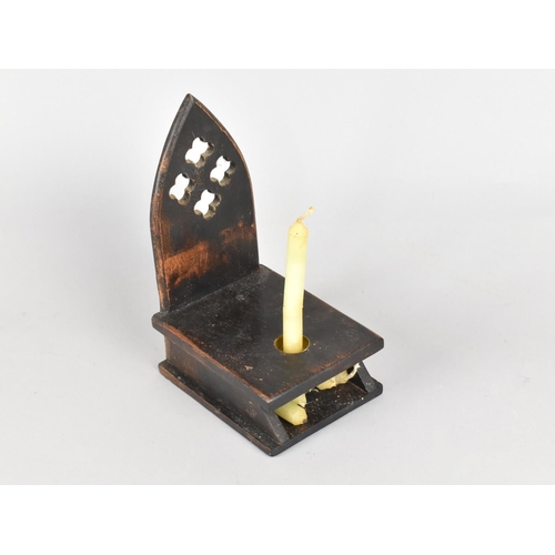 8 - A Christian Oak Candle Wall Sconce with Storage Area Containing Candles, 20cms High