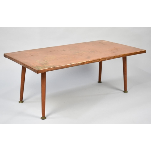 95 - A 1970s Copper Topped Rectangular Coffee Table on Turned Supports, 84cms Wide