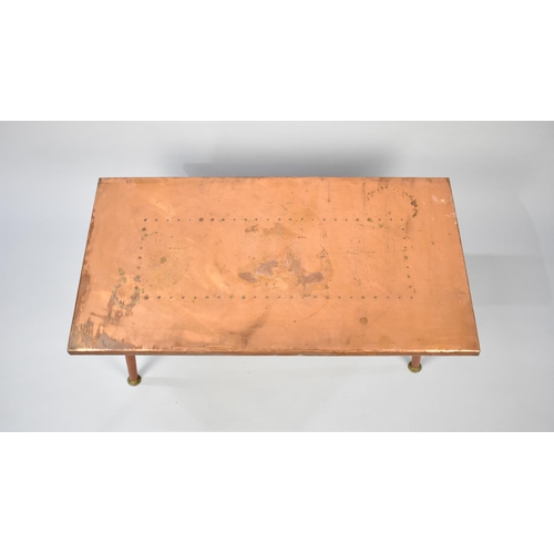 95 - A 1970s Copper Topped Rectangular Coffee Table on Turned Supports, 84cms Wide