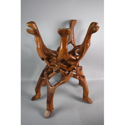 557 - A Carved African Folding Table Base