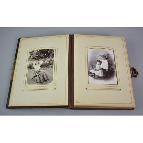 58 - A Late Victorian Photo Album with Brass Clasp Containing some Family Photographs, 28x23cm