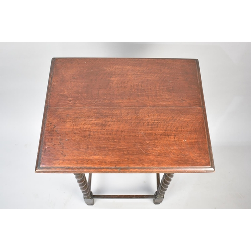 77 - An Edwardian Oak Rectangular Topped Occasional Table with Barley twists Supports, 50x40x76cm High