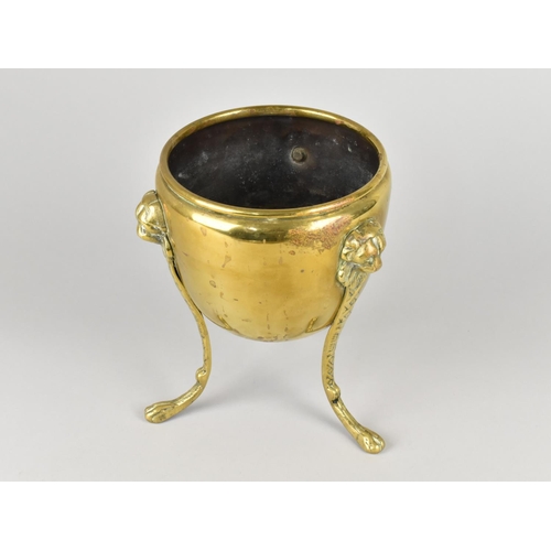 84 - A Georgian Brass Three Footed Bowl with Lion Mask Decoration,  15cm Diameter and 20cm High