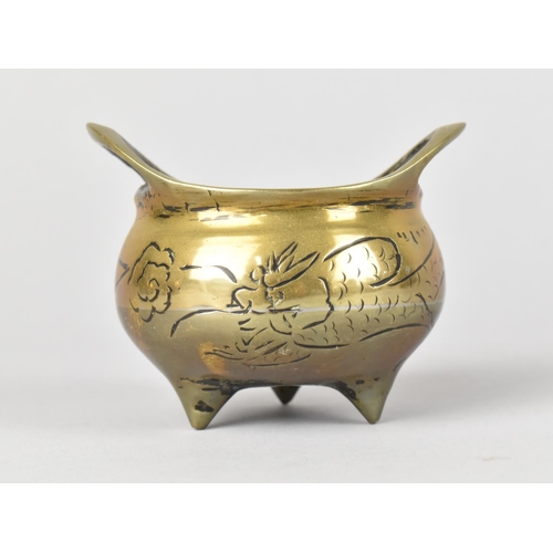 9 - A Chinese Bronze Two Handled Censer with Three 
Feet, 8cm Wide