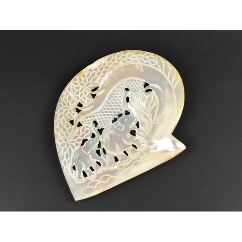 136 - A Carved and Pierced Section of Mother of Pearl Decorated with Elephants in Forest, 17cms High