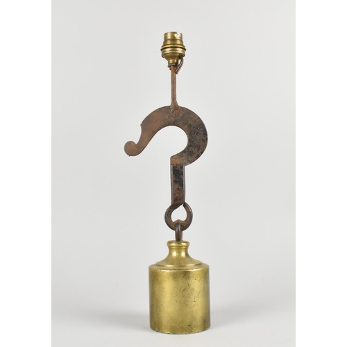 18 - A Novelty Table Lamp Base formed From a Brass Cylindrical Weight and a Cast Iron Hook, 37cms High