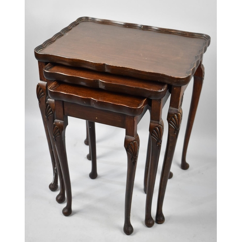 243 - A Nest of Three Mahogany Tables, 49cms Wide