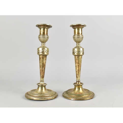 31 - A Pair of Silver Plated Candlesticks, 24cms High with Swag Decoration