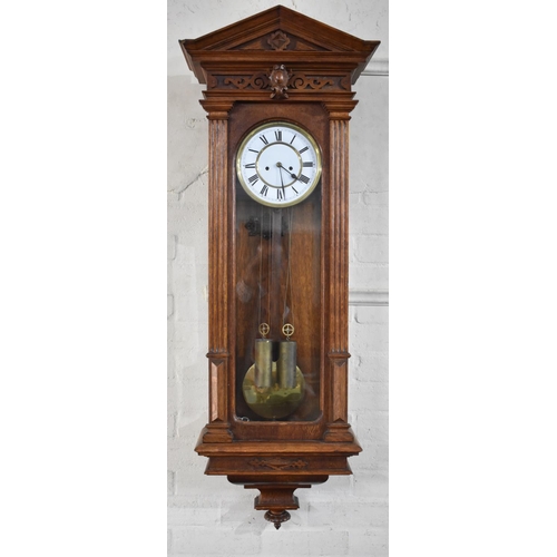 344 - A Vienna Style Wall Clock of Architectural Form with Two Weights and Pendulum