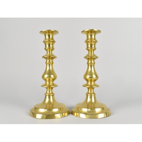 51 - A Pair of Brass Candlesticks with pushers, 22.5cms HIgh