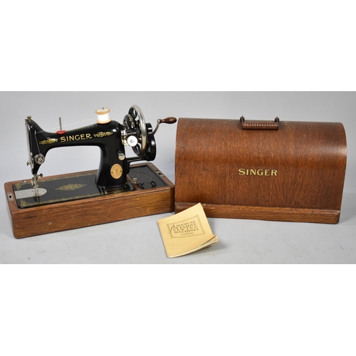 552 - A Vintage Oak Cased Manual Singer Sewing Machine