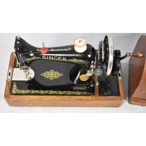 552 - A Vintage Oak Cased Manual Singer Sewing Machine