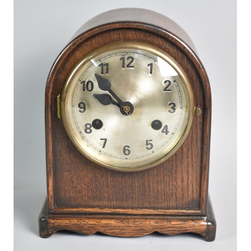 65 - A Mid 20th Century Oak Cased Arch Topped Mantel Clock with Wurttemberg Movement, 21.5cms High