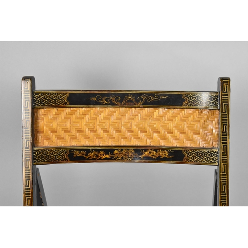 79 - A Lacquered Chinoiserie Folding Chair with Cane Seat and Back