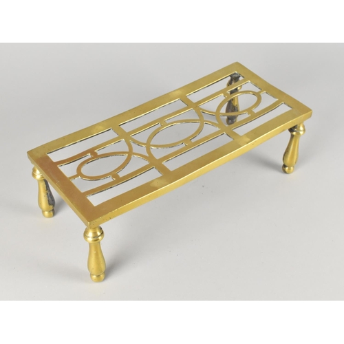 80 - A Late Victorian/Edwardian Brass Trivet Stand with Pierced Top, 30.5cms Wide